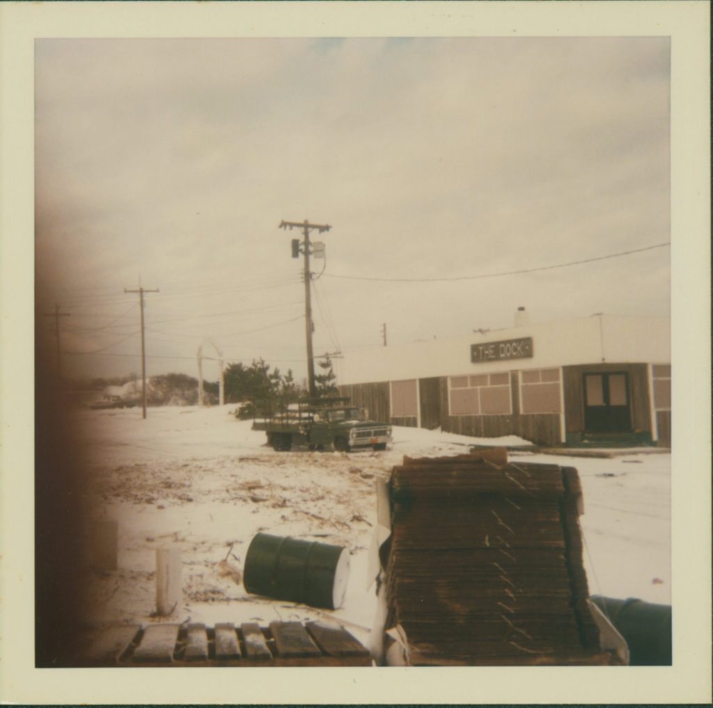 A shuttered building in a snowy landscape.